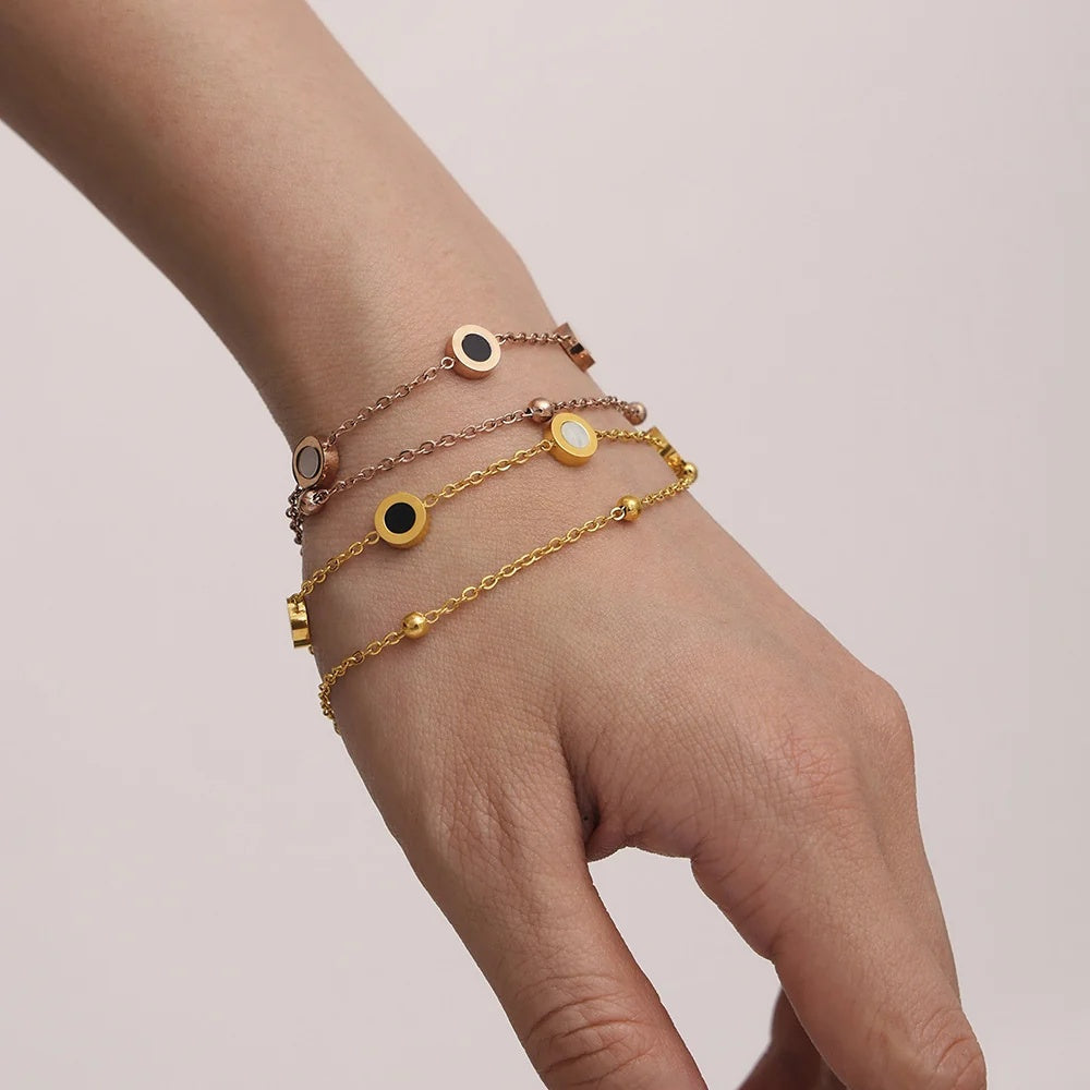 Eclipse Bracelet layered on the wrist