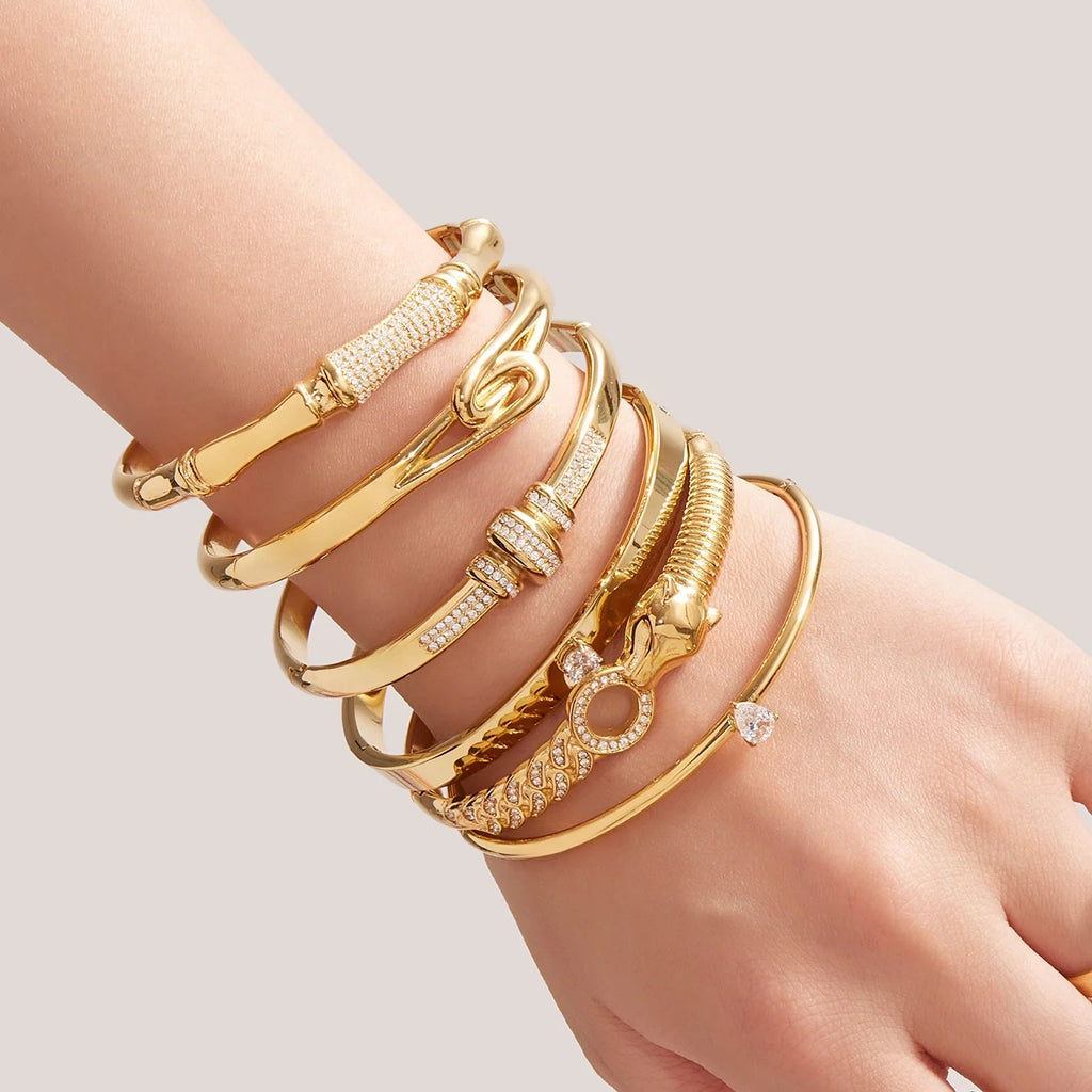 Gold bangles stacked on the wrist