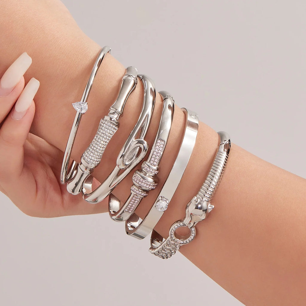 Silver bangles stacked on the wrist