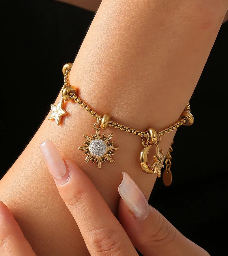 Gold Celestial Charm Bracelet on wrist