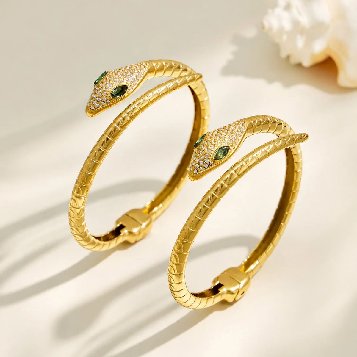 Two gold Viper Bangles