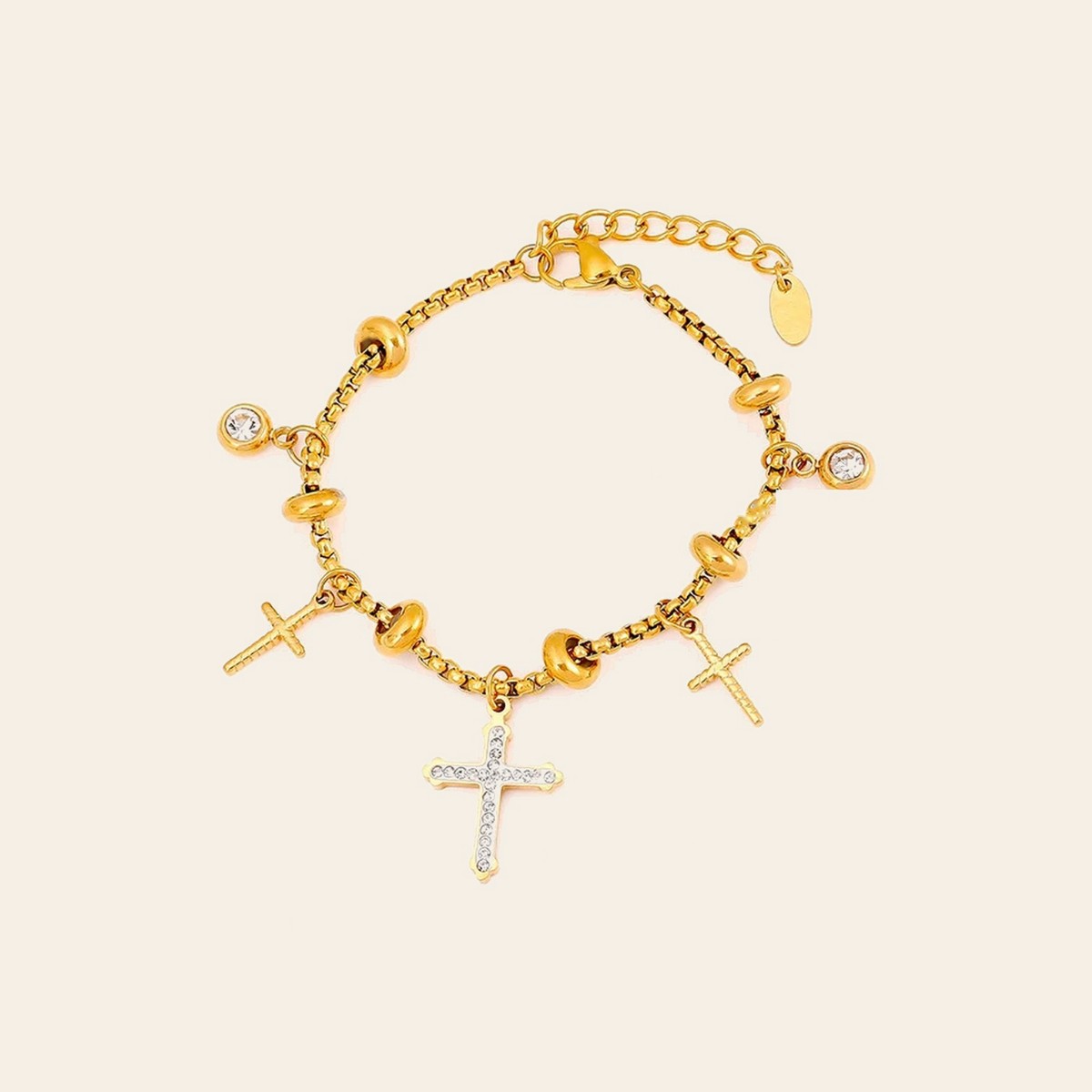 The Cross Charm Bracelet in gold