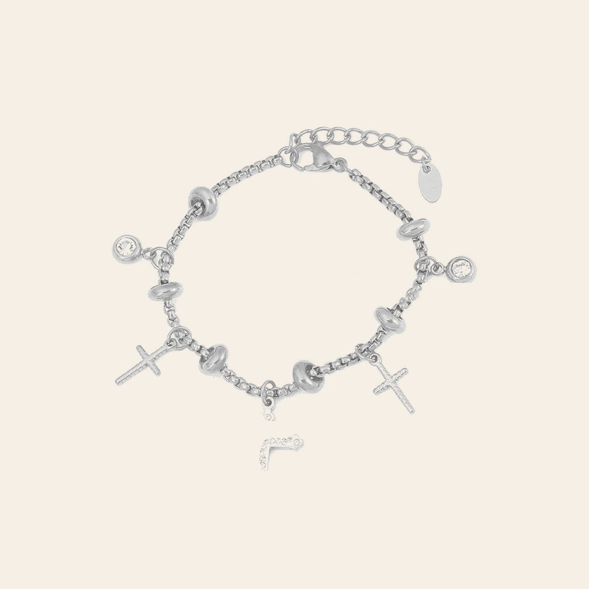 The Cross Charm Bracelet in silver