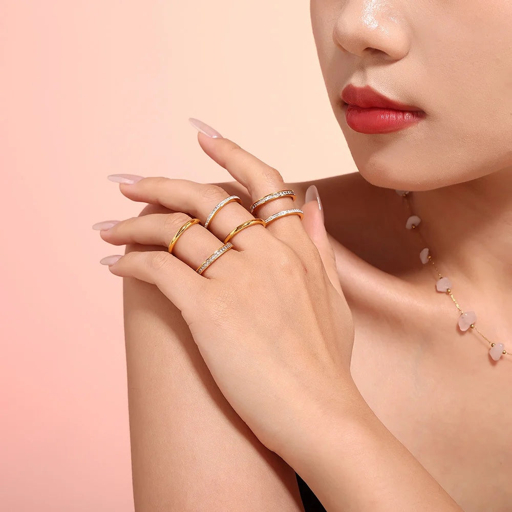 Glimmer and Twinkle Rings stacked on the hand
