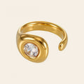 The Orbit Ring, a gold wrap ring with a single stone