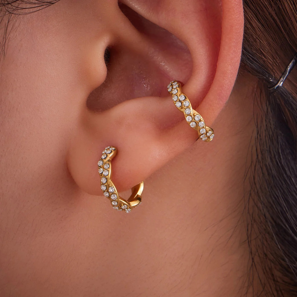 Gold Twist Ear Cuffs on the ear